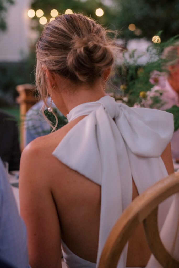 bride wearing large bow dress during wedding reception in Sonoma, ca. 