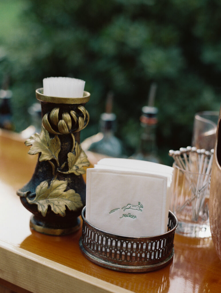 close up of bar design during Napa, ca wedding with candle sticks and napkins. 